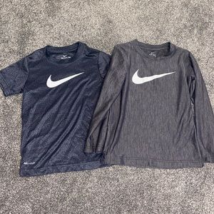 two gray Nike dry fit shirts